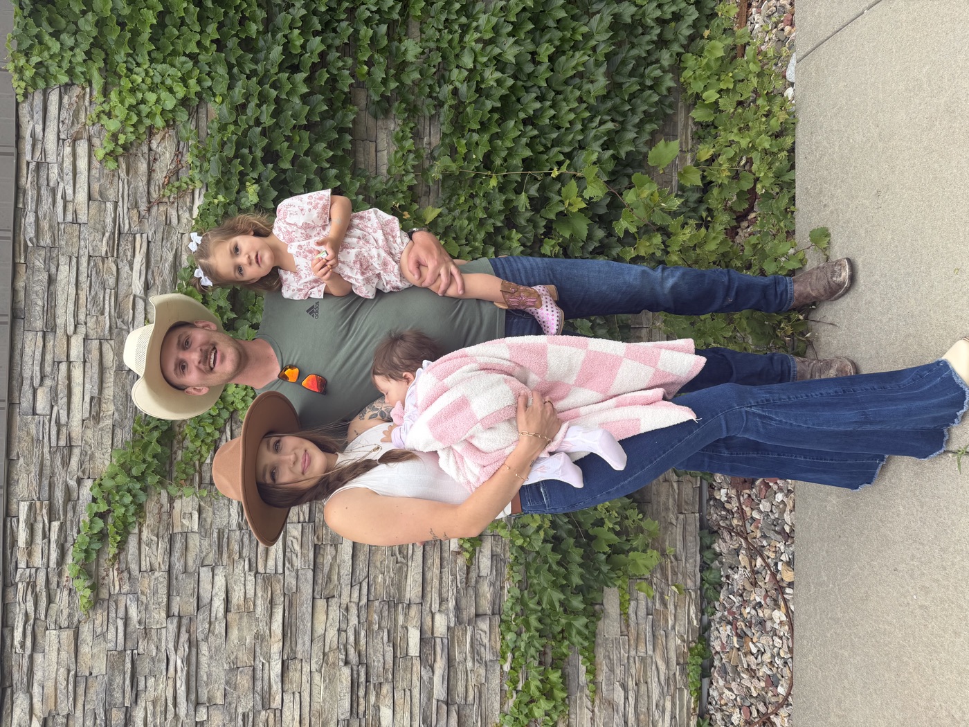 Davis and his family in front of a stone wall